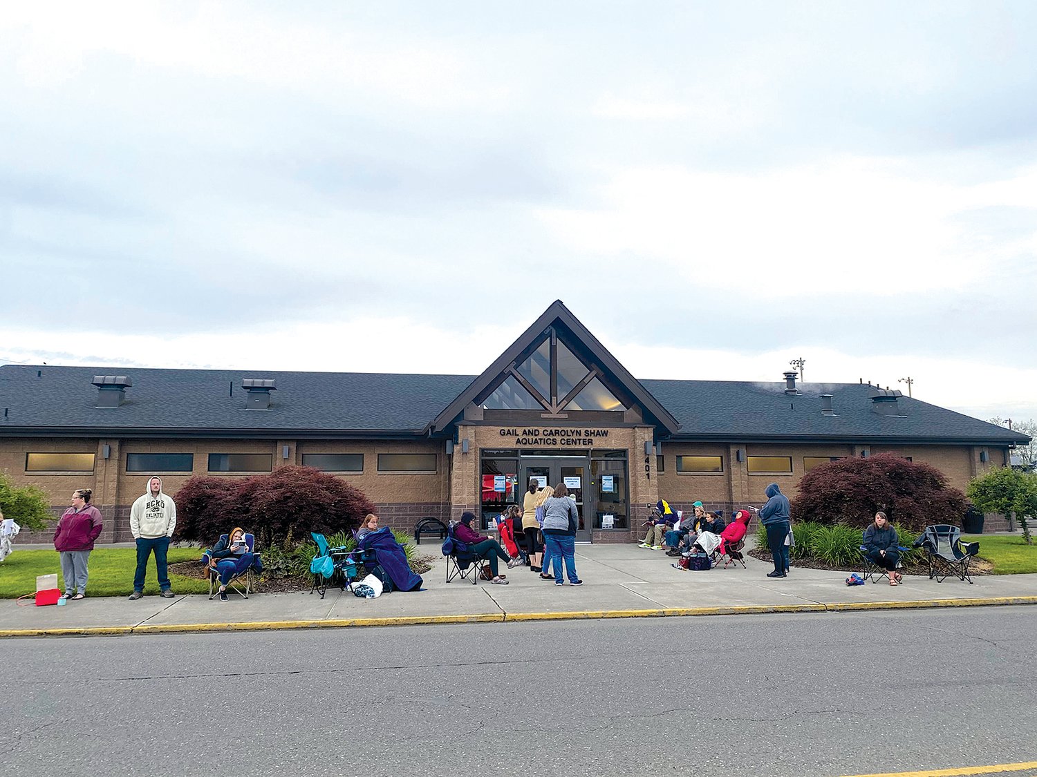 Residents line up outside the Gail and Carolyn Shaw Aquatics Center to sign up for swimming lessons at about 6:20 a.m. Friday.